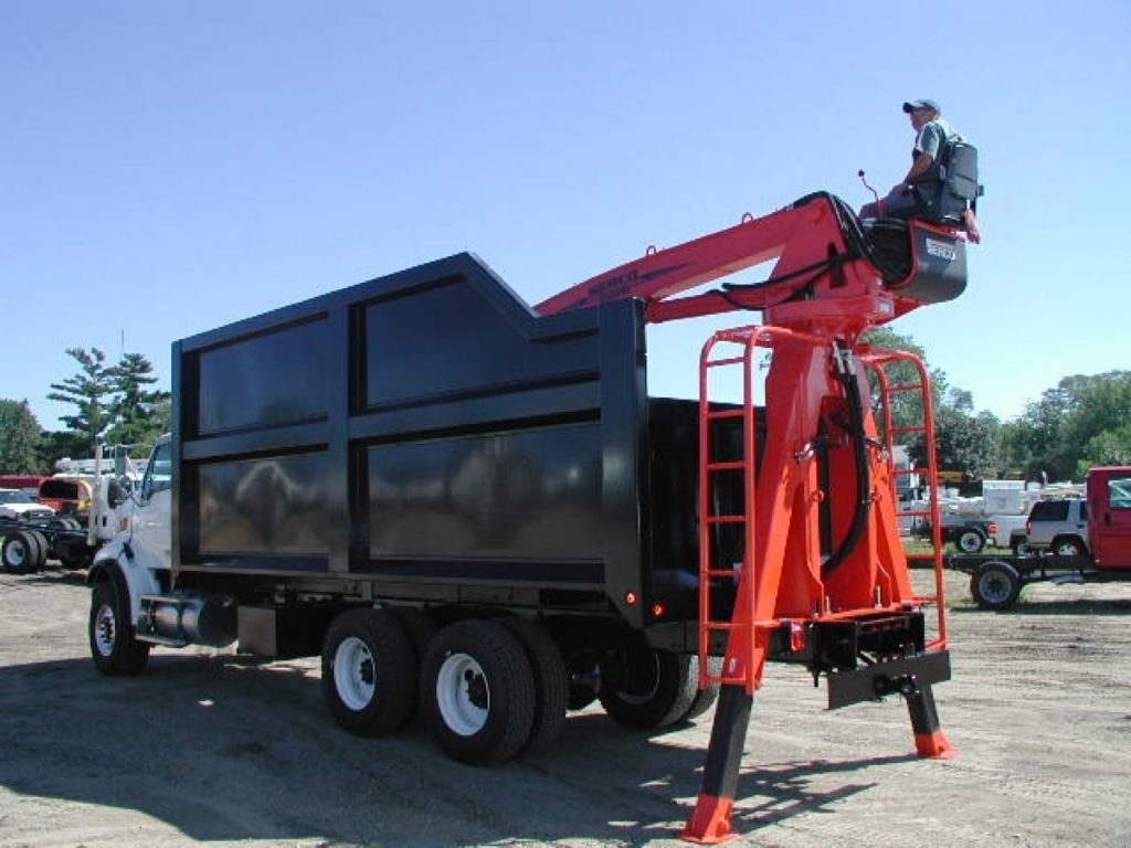 Serco 230B 23000 lbs capacity material loader with jersey barrier handling attachment