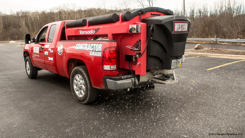 Western Plows pre-wet system hopper spreader pre-wet material into a liquid brine solution