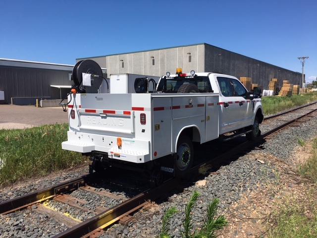 Purpose-built hi-rail signal maintainer service truck