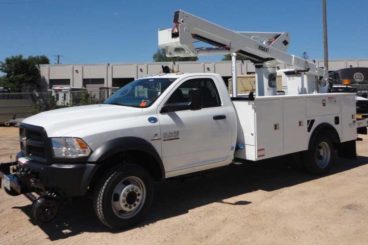 Purpose-built Ram 5500, Versalift SST40, 40 ft reach, 12 ft service body with fall protection, Harsco hi-rail, strobe and spot light