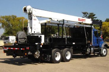 Mack bridge truck, Elliott 1870 crane, 36,000 lbs capacity, 70 ft reach, 16 ft flatbed with storage, DMF hi-rail, 5/10 GPM tool circuit, strobe and spot light package