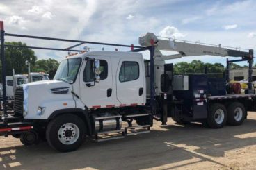 Freightliner 108SD bridge truck, National 671 crane, 20,000 lbs capacity, 37 ft reach, 18 ft flatbed with fall protection and storage, DMF hi-rail, 5/10 GPM tool circuit, strobe and spot light package