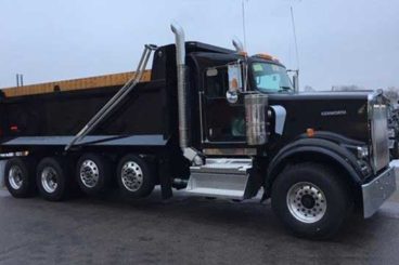 19 ft Bibeau dump body mounted on quad axle Kenworth chassis