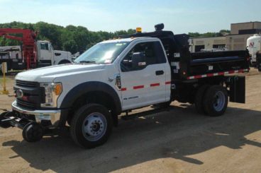 Purpose-built Ford F-550, Henderson 11 ft dump body, Harsco Hyrail, strobe and spot light package