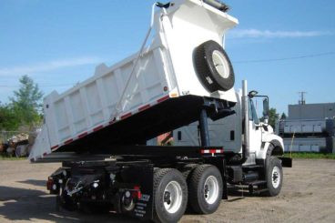 Purpose-built Freightliner 114SD, 14 ft rotating dump bed, DMF hi-rail, strobe and light package