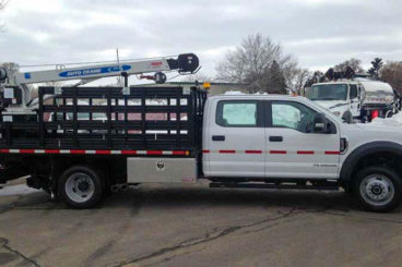 Purpose-built Ford F-550, 11 ft flatbed with tool boxes, Auto Crane 5005EH crane, 5,000 lbs capacity, 16 ft reach, Harsco hi-rail