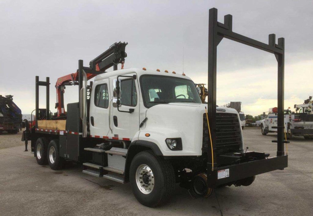 Freightliner 114SD, Palfinger PK18002EH 13,670 lbs capacity, 25'11 reach, 20 ft custom section body with storage and railracks, 5/10 GPM tool circuit, Harsco Hy-Rail, strobe and spotlight package