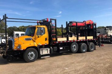 Freightliner 114SD, Palfinger PK 37002, 25'3 reach, 28,500 lbs capacity, Heiden railroad grapple truck, Continental Hi-rail, 22 ft flatbed with rail racks, rail flanges and custom storage, Moley 12/24 32 ft magnet