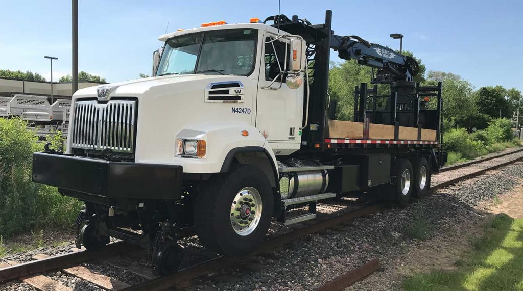 Western Star 4700, Serco 8500 with 24 ft reach, 8,500 lbs capacity, Heiden railroad grapple truck, Continental Hy-rail, 22 ft flatbed with rail racks, Moley 12/24 32 ft magnet, Aspen Creep Drive