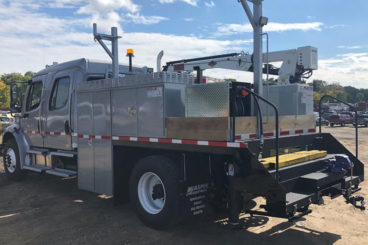 Freightliner M2-106, IMT 2020 crane 5,000 lbs capacity, 20 ft reach, 16 ft custom section body with storage and railracks, 5/10 GPM hydraulic tool circuit, DMF hi-rail, strobe and spotlight package