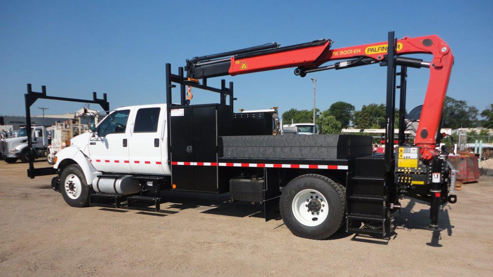 Ford F750, Palfinger PK 9000 19,000 lbs capacity, 18'4 reach, 14 ft section body with storage and railracks, 5/10 GPM hydraulic tool circuit, Harsco Hyrail, strobe and spotlight package