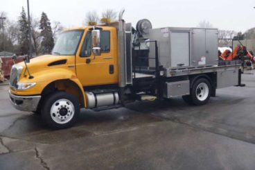 Sign truck with custom aluminum body, service crane, catwalk, and accessories