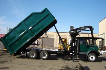22 ft Aspen Equipment dumping tree truck body with Mailhot hoist and rear safety latched barn-doors