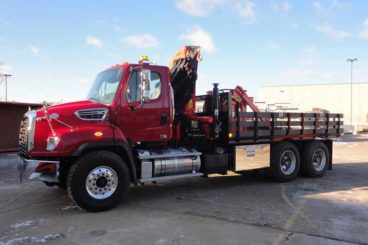 Palfinger PK 22002 EH material hauling truck with articulating crane