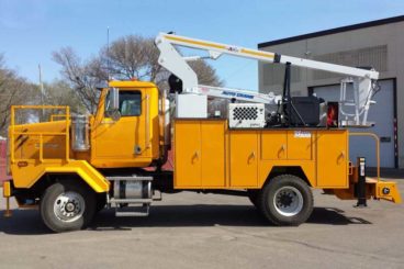 Armlift Patriot aerial work platform mounted on a specialty Tooth Changer vehicle equipped with crane and welder