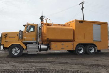 Tandem axle semi-enclosed lube truck with 3,000 gallon diesel fuel tank