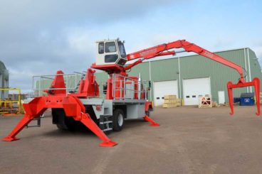 Cable reel handling truck with enclosed operator control cab