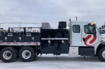 Purpose-built cable reel handling hauler and maintenance body