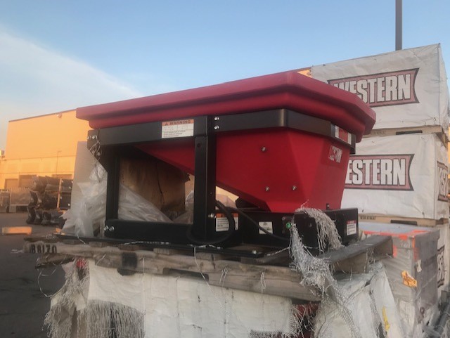 Western Plows pre-wet system hopper spreader pre-wet material into a liquid brine solution