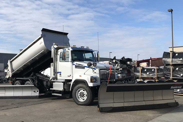 One ton plow truck with stainless steel body and Western multi-width snow plow