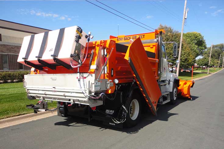 One ton plow truck with stainless steel body and Western multi-width snow plow