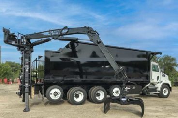 Western Star with a 22’ Brandon tree body and a Serco 1050 grapple unit