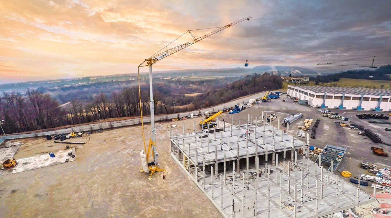 Manitowoc Potain self-erecting tower crane on a job site