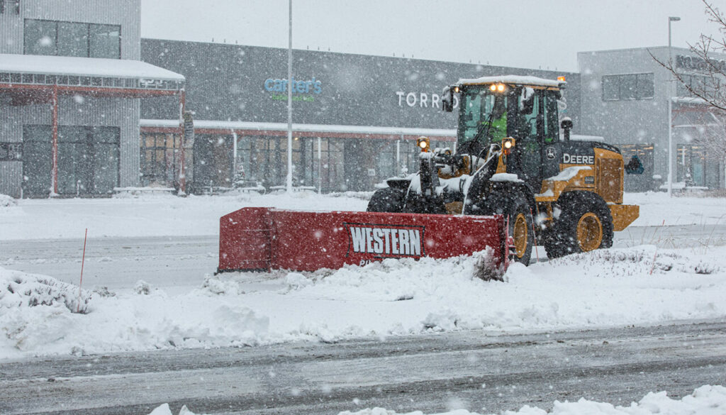 Western Plows pre-wet system hopper spreader pre-wet material into a liquid brine solution