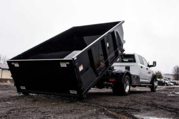 Switch-N-Go drop box or bin is a mini-rolloff container available with a swing gate or barn door gate, optional curbside door, and lengths ranging from 8 to 15 feet.