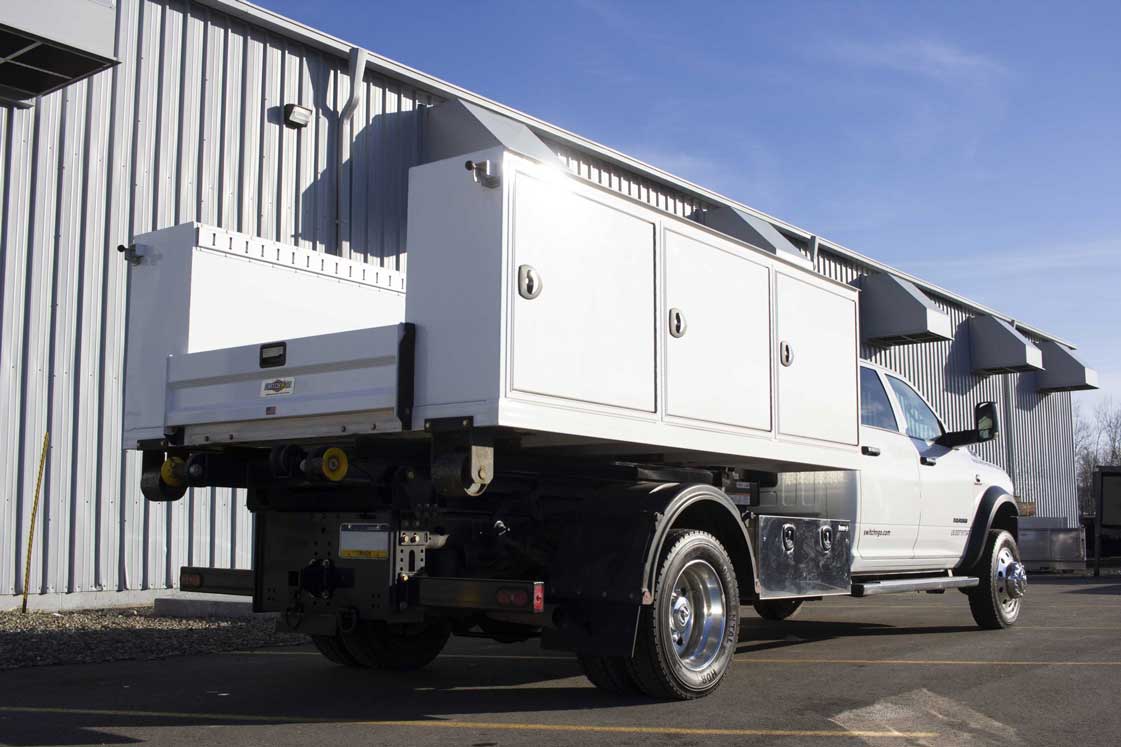 Switch-N-Go aluminum flatbed service body with adjustable shelves and dividers for security and storage of tools