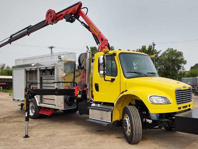 Purpose-built custom body, rear mount Palfinger knuckleboom crane, flatbed chassis, rear outriggers