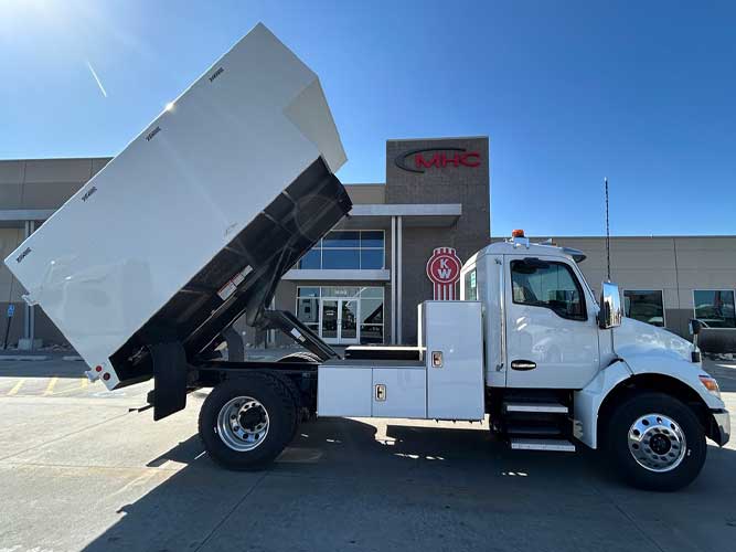 20 cubic yard capacity ArborTech chipper body truck with hydraulic hoist, pruner shelf, 20,000 lb capacity tow package, mounted on 2025 Kenworth diesel
