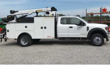 White Ford F-550 XL SuperCab truck chassis with Palfinger PAL Pro 39 steel mechanics body, 60 inch tall raised compartments and 44 inch tall passenger compartments, and 6,000 lb hydraulic service crane.