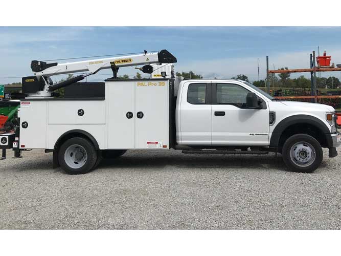 White Ford F-550 XL SuperCab truck chassis with Palfinger PAL Pro 39 steel mechanics body, 60 inch tall raised compartments and 44 inch tall passenger compartments, and 6,000 lb hydraulic service crane.