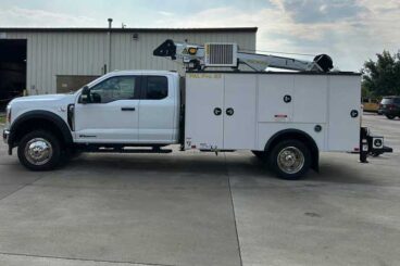 White mechanics truck upfit with Ford F-550 extended cab chassis and PAL Pro 43 mechanics body parked outside of a business