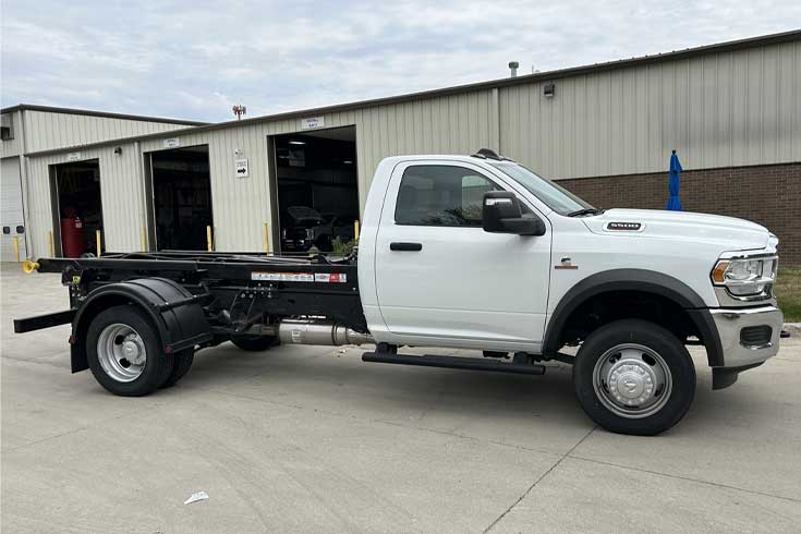 SwapLoader hooklift system, Henderson Products contractor dump body, and cross-box toolbox mounted on regular cab RAM truck.