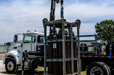 Flatbed work truck with HIAB medium duty knuckle boom crane.
