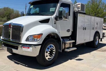 White large heavy-duty truck parked outdoors with PAL Pro 72 wording on the body.