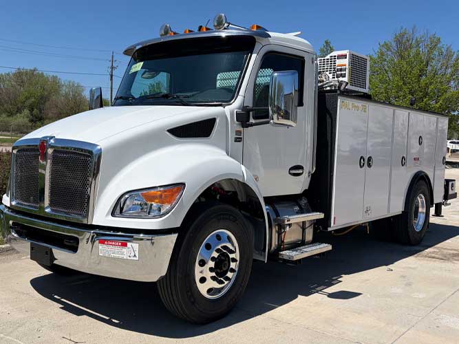White large heavy-duty truck parked outdoors with PAL Pro 72 wording on the body.