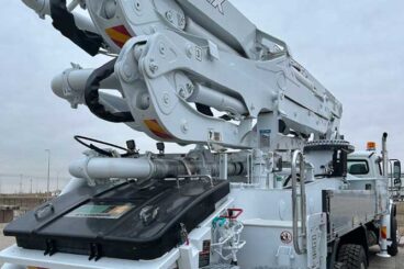 View of boom section of an Everdigm concrete boom pump truck