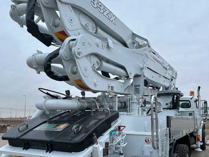 View of boom section of an Everdigm concrete boom pump truck